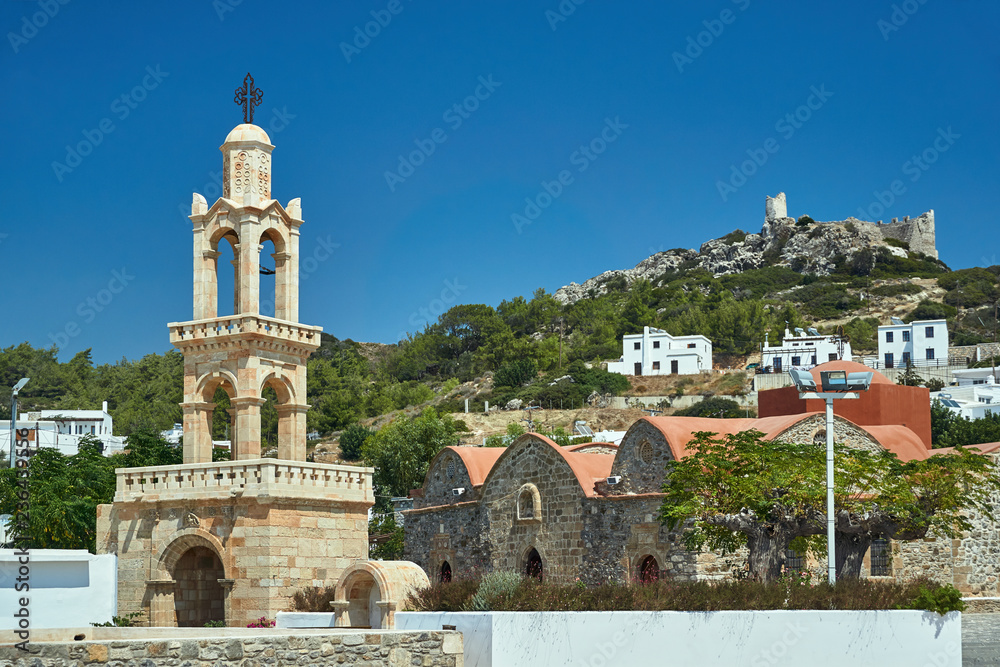 Tower of the Byzantine church and the ruins of the medieval castle in Asklipio on the island of Rhodes.