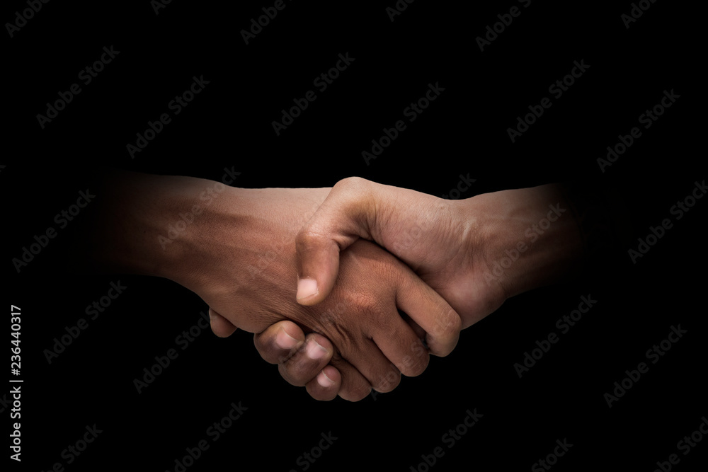 Male hand finger sign over dark background Male hand finger sign over dark background