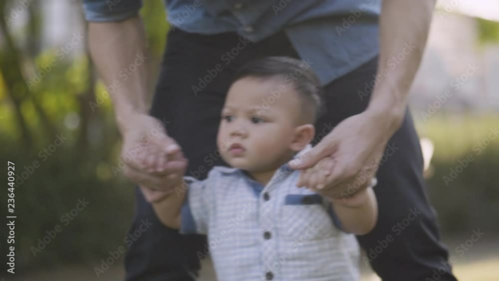 Asian dad is taking care of the toddler son, Family and lifestyle concepts Asian dad is taking care of the toddler son, Family and lifestyle concepts