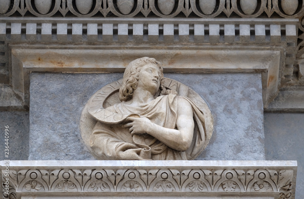 Prophet Daniel, relief on the portal of the Cathedral of Saint Lawrence in Lugano, Switzerland Prophet Daniel, relief on the portal of the Cathedral of Saint Lawrence in Lugano, Switzerland
