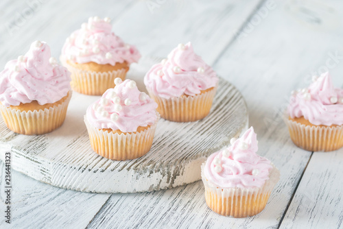 Many pink cream homemade cupcakes