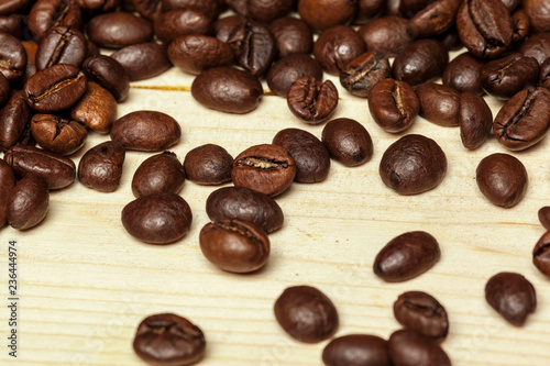 Close up of coffee beans on a wooden background