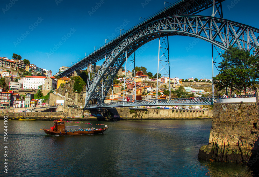 Naklejka premium Tradirional boat Barcos rabelos in the old town on the Douro River in Ribeira in the city centre of Porto in Porugal, Europe.