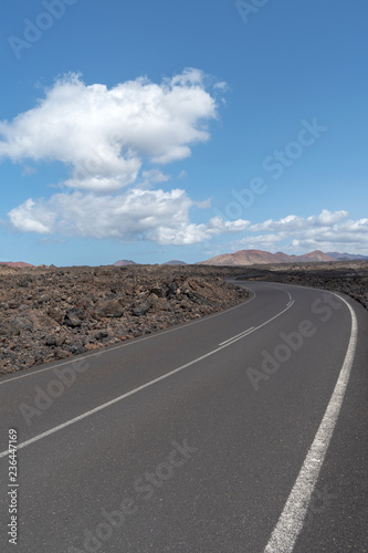 Road crossing volcanic terrain, Lanzarote Island, Canary