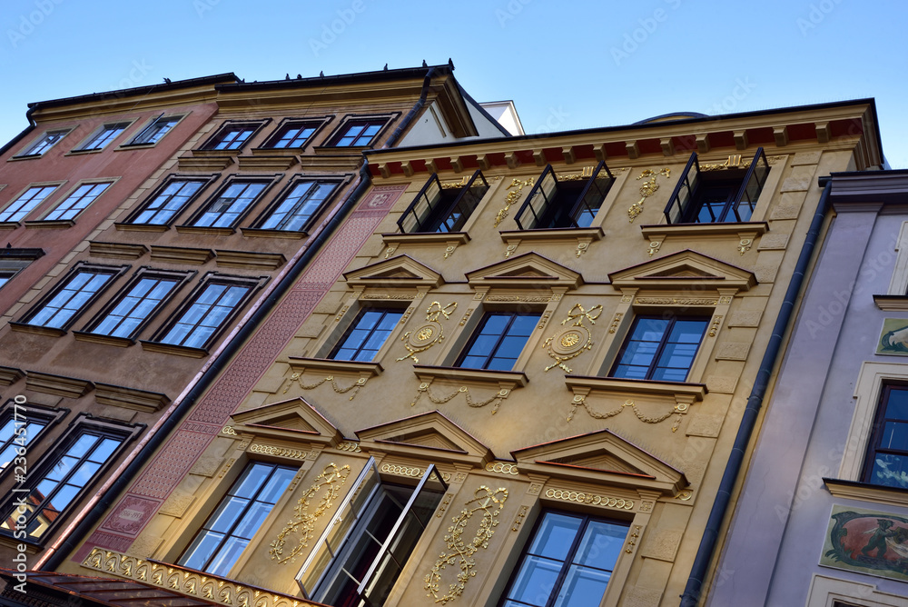 Decorated tenement houses of the old city of Warsaw, photo at an angle. Decorated tenement houses of the old city of Warsaw, photo at an angle.