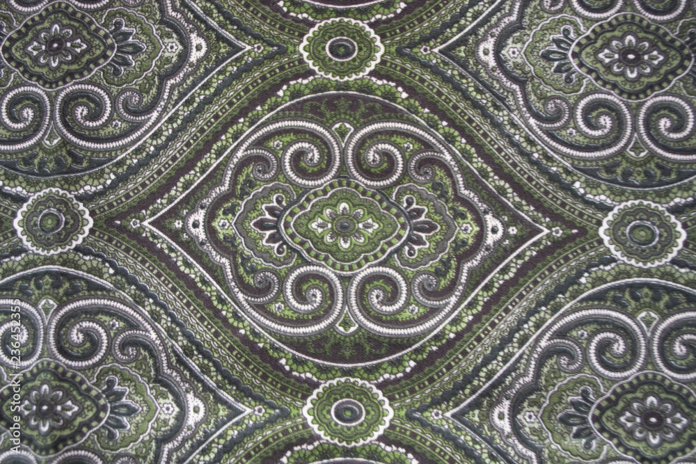 Background. East pattern on fabric. Khaki, green. Background. East pattern on fabric. Khaki, green.