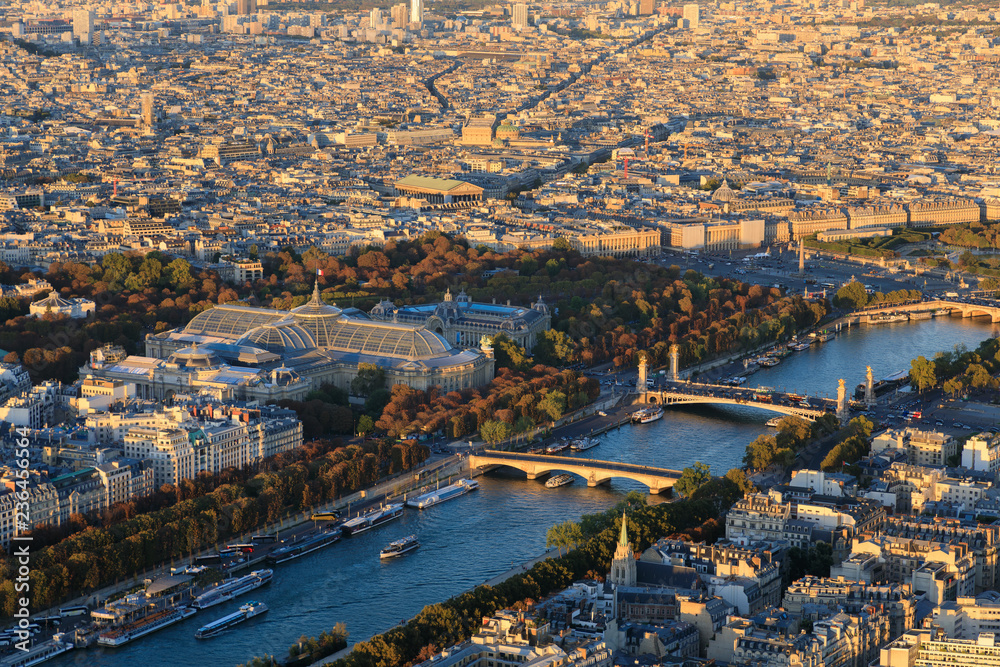 Aerial: Cityscape of Paris in sunset
