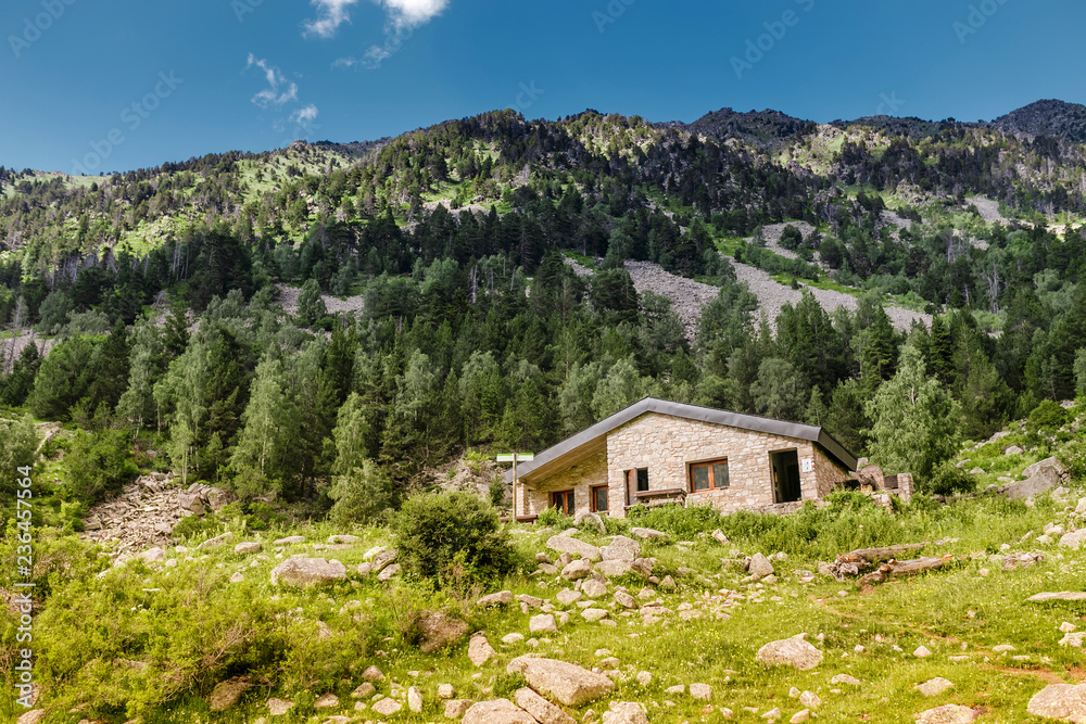 A public stone house is an open free shelter for all travelers and hikers in the mountains of the Pyrenees