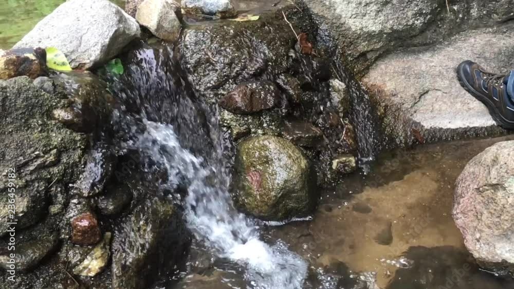 A small waterfall in the jungle of Thailand in summer. A small waterfall in the jungle of Thailand in summer.