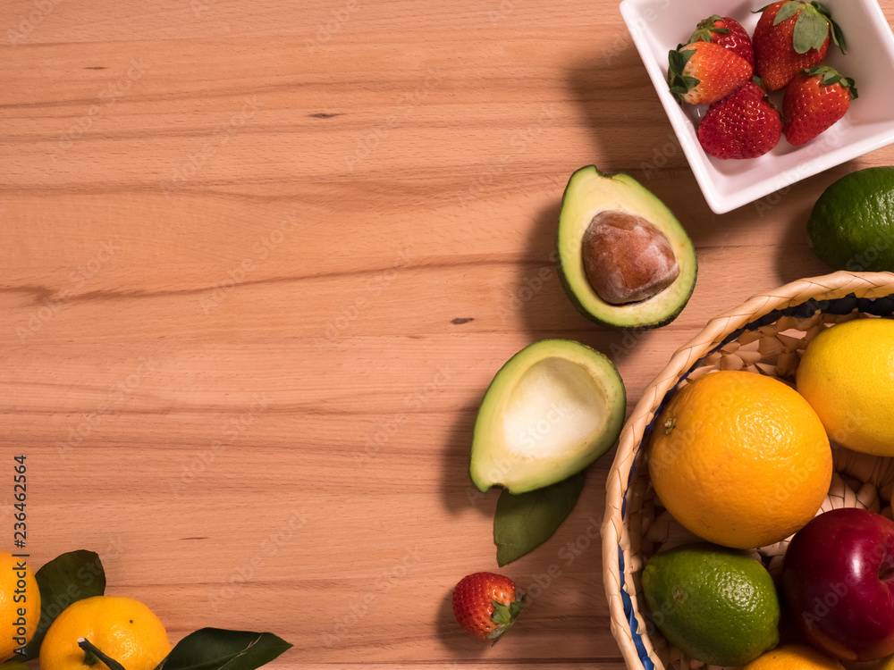 close up of fruits and berries lying on a wooden surface. Background close up of fruits and berries lying on a wooden surface. Background