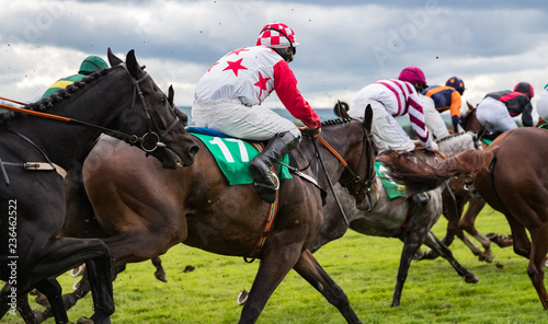 Close-up on fast action horse racing