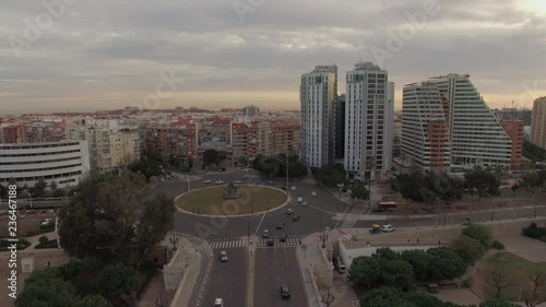 VALENCIA, SPAIN - JANUARY 13, 2018: Aerial shot with city buildings, car traffic on Angel Custodi bridge and Gulliver Park. Evening shot in winter photo