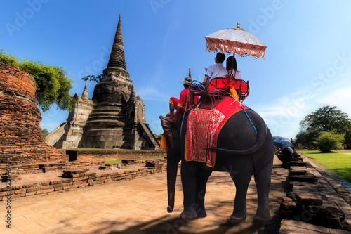 Foreign tourists Elephant ride to visit Ayutthaya, There are ruins and temple in the Ayutthaya period.Concept is Travel in temple phar sri sanphet. © Suppasit