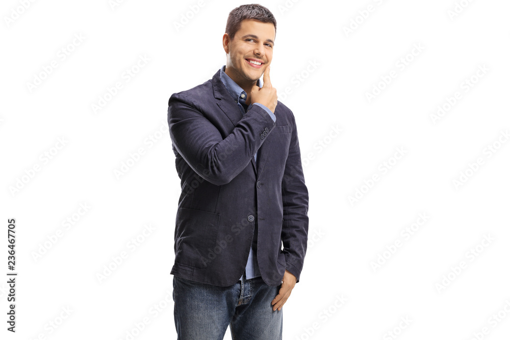 Handsome young man pointing on his cheek Handsome young man pointing on his cheek