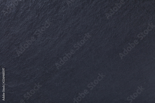 Dark gray background of natural slate. Texture black stone