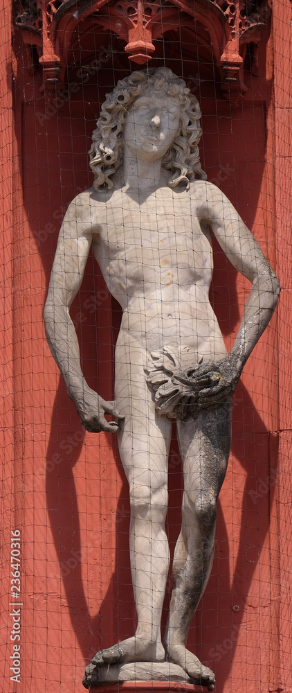 Statue of Adam on the portal of the Marienkapelle in Wurzburg, Bavaria, Germany