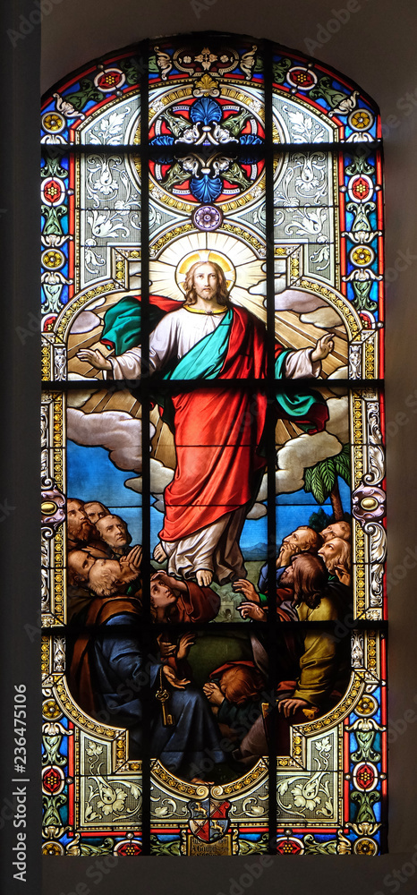 Fototapeta premium Ascension of Christ, stained glass window in the Saint Nicholas Evangelical church, Aalen, Germany