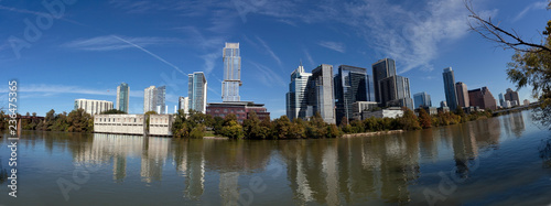 Austin, Texas skyline panorama with Ladybird lake in the foreground.