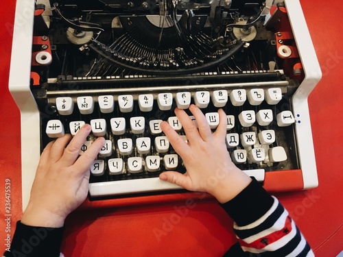 Kid types a letter photo