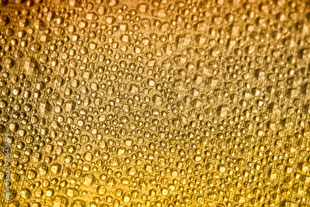 Drops of water on a color background. Orange. Shallow depth of field. Selective focus. Toned