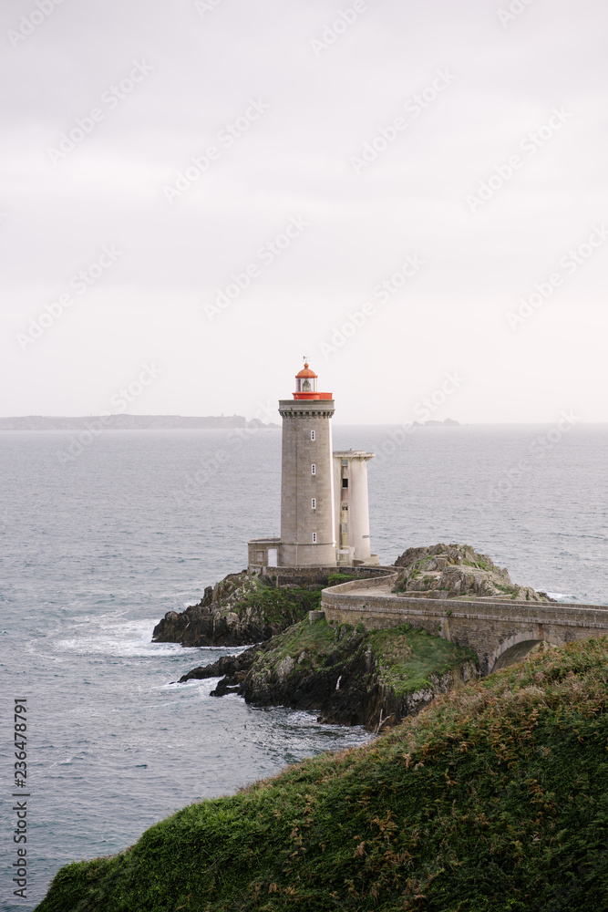 Picturesque view of lighthouse on rock Picturesque view of lighthouse on rock