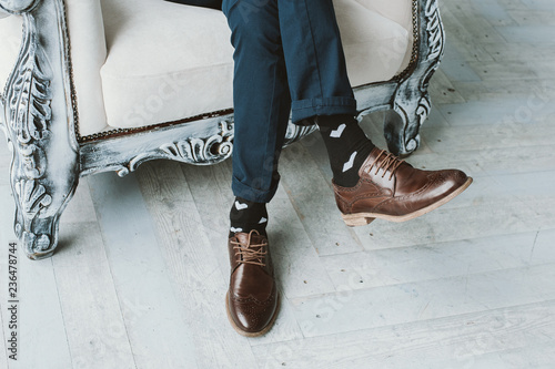 Man wearing classic shoes and funny socks photo