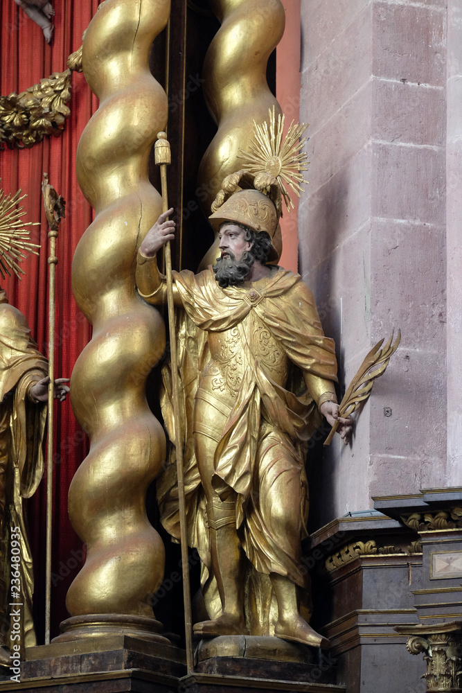 Obraz premium Saint Vitalis statue on the main altar in Cistercian Abbey of Bronbach in Reicholzheim near Wertheim, Germany