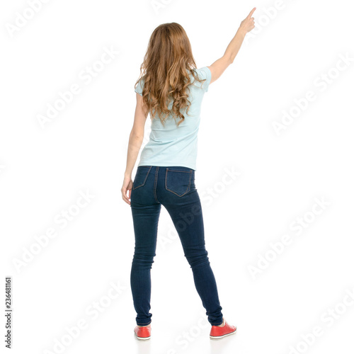 Beautiful woman goes walking showing on a white background. Isolation back view