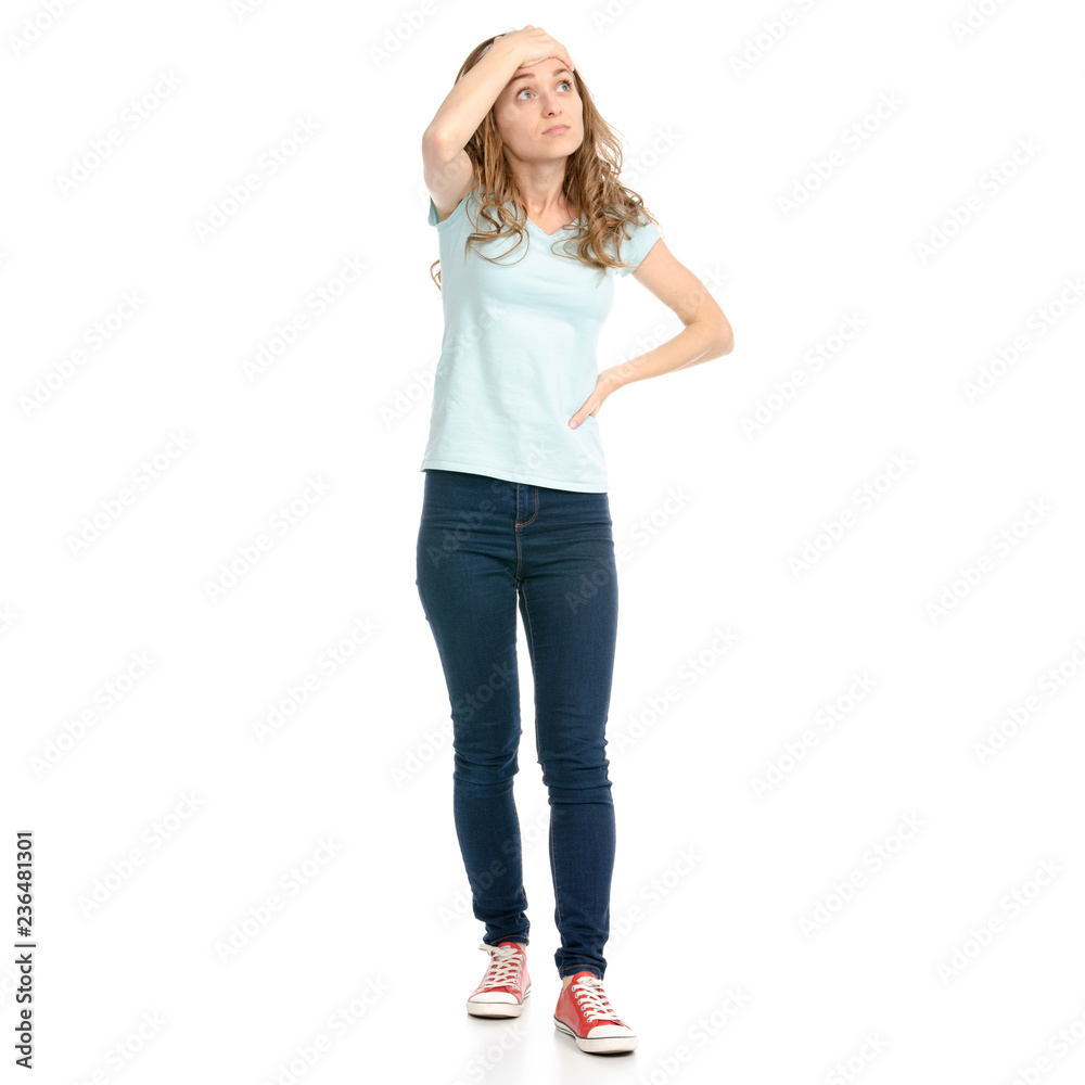 Beautiful woman in jeans holding head on a white background. Isolation Beautiful woman in jeans holding head on a white background. Isolation