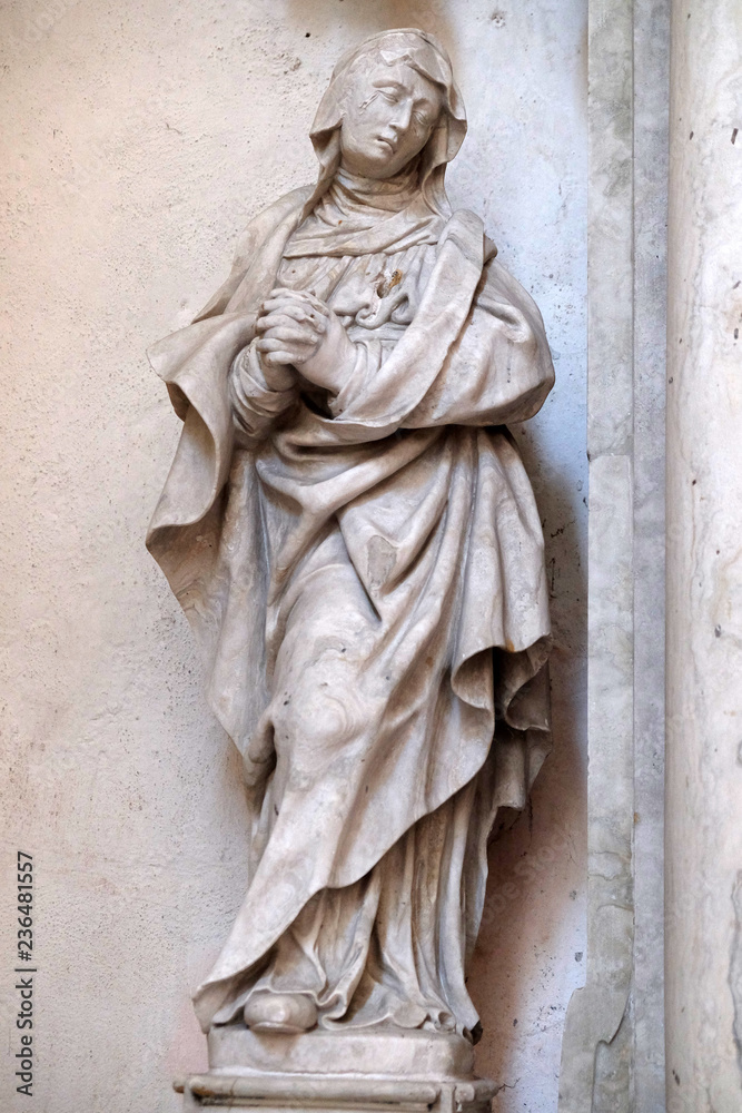 Statue of Saint on the altar of the Saint Mary Magdalene in Cistercian Abbey of Bronbach in Reicholzheim near Wertheim, Germany