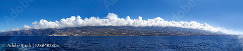 Tenerife Island in the clouds from the open ocean