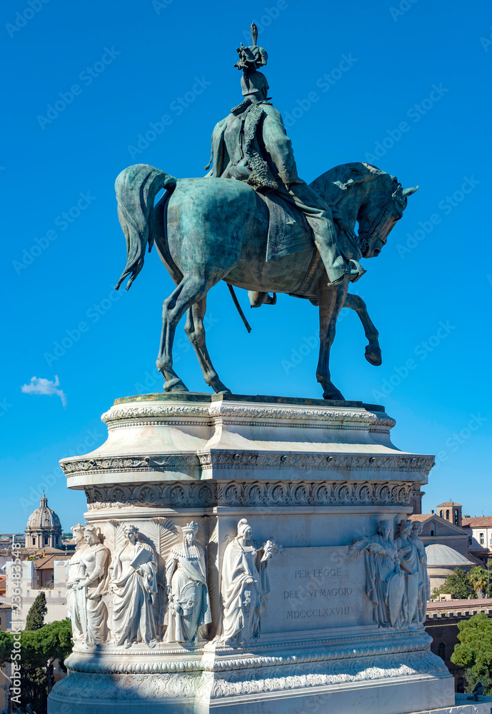 Obraz premium Rome, Italy - Mar 1, 2017: View from below and from behind of the equestrian statue of the Vittoriano in Rome..On the basement is reported the following words: