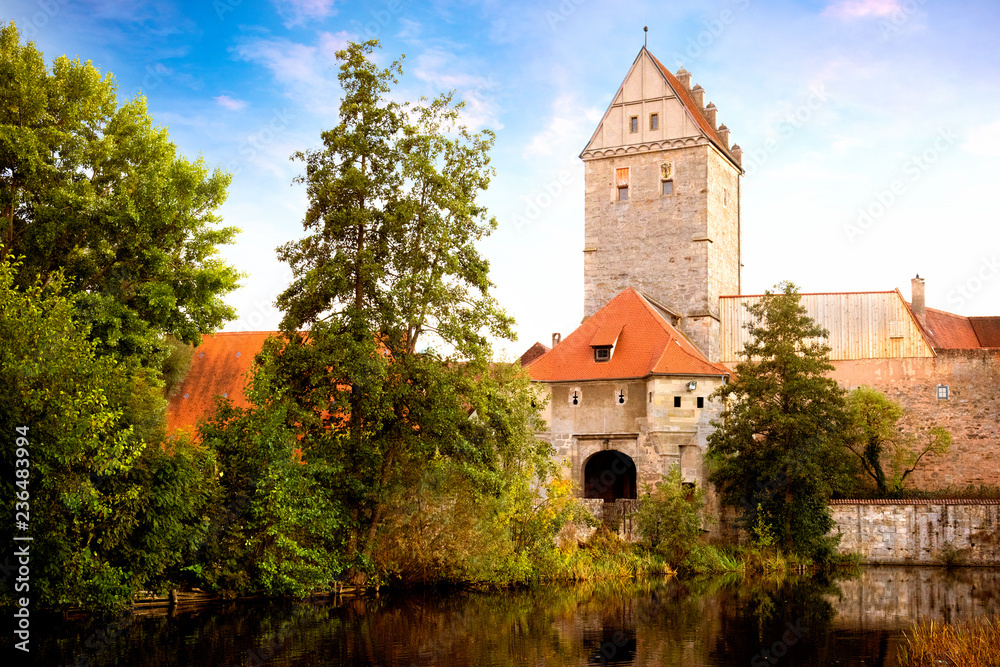 Historic old town of Dinkelsbuhl, reflecting in the river. landmark at the romantic road middle Franconia, Germany Historic old town of Dinkelsbuhl, reflecting in the river. landmark at the romantic road middle Franconia, Germany
