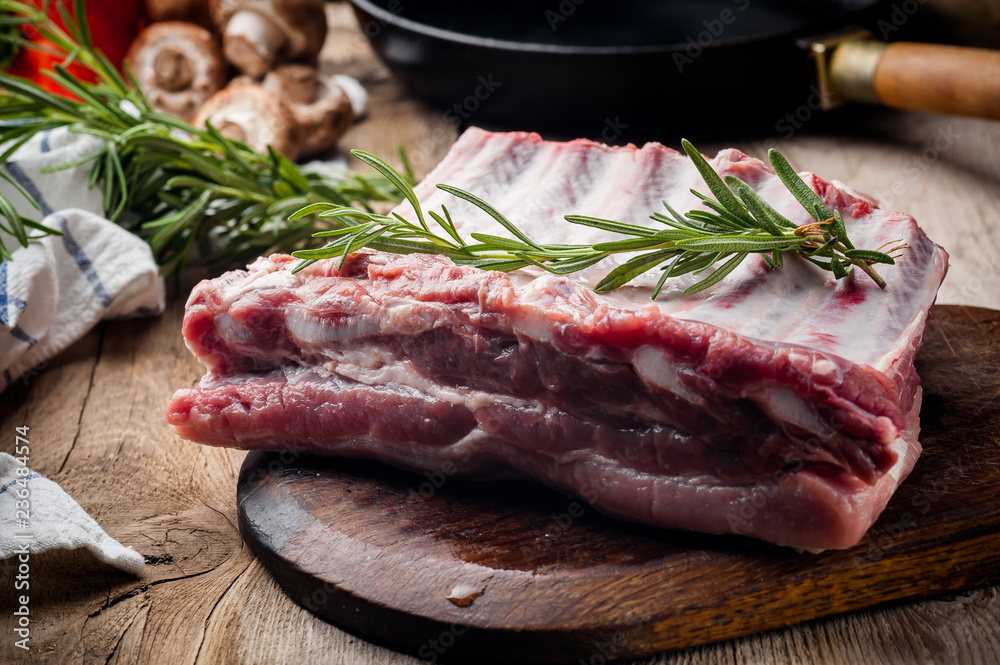 fresh meat on a wooden board. Steak, ribs polar bear, heel