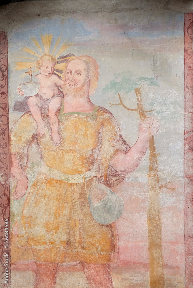 Saint Christopher, fresco on the facade of Saint George church in Luson, Italy