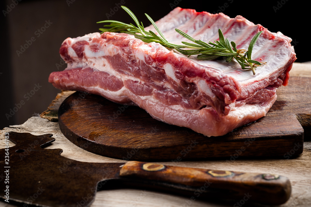 fresh meat on a wooden board. Steak, ribs polar bear, heel fresh meat on a wooden board. Steak, ribs polar bear, heel