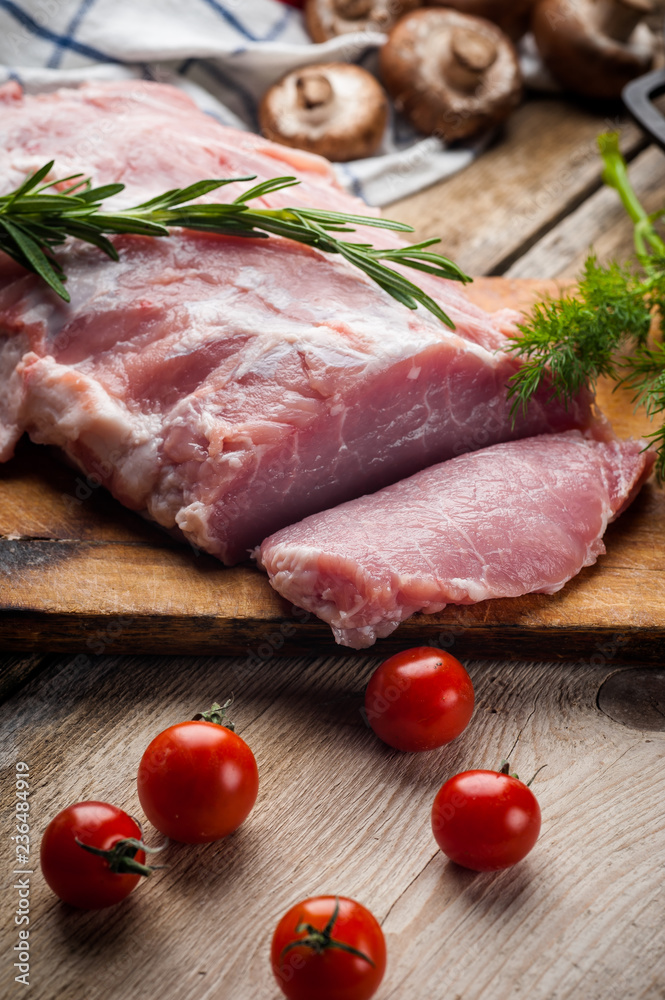 fresh meat on a wooden board. Steak, ribs polar bear, heel fresh meat on a wooden board. Steak, ribs polar bear, heel