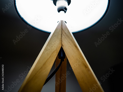 Wooden lamp with a dark lampshade