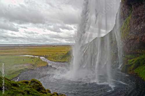 Seljalandsfoss waterfall seen from behind