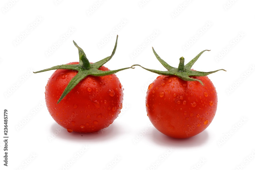 fresh red cocktail tomatos with drops of water isolated on white fresh red cocktail tomatos with drops of water isolated on white