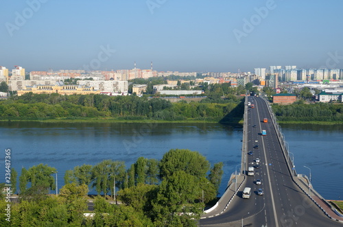 Nizhny Novgorod, Russia - August 19, 2018: Summer view of Kanavinsky bridge over the Oka river  photo