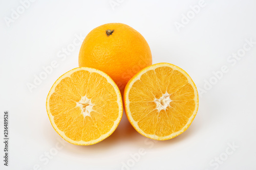 Cut citrus fruit of orange on white background