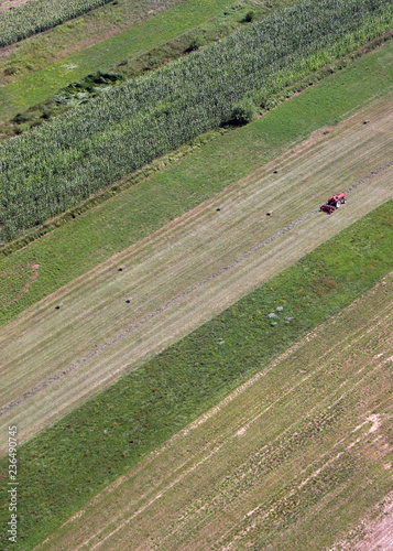 An aerial view of tractor working in a field in Sisljavic Croatia