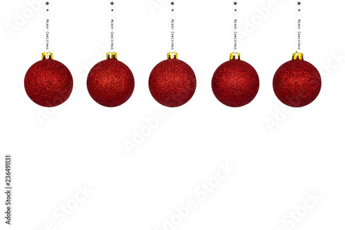A red Christmas bauble hanging on a white ribbon, isolated on a white background with a clipping path and copy space, christmas decorations.
