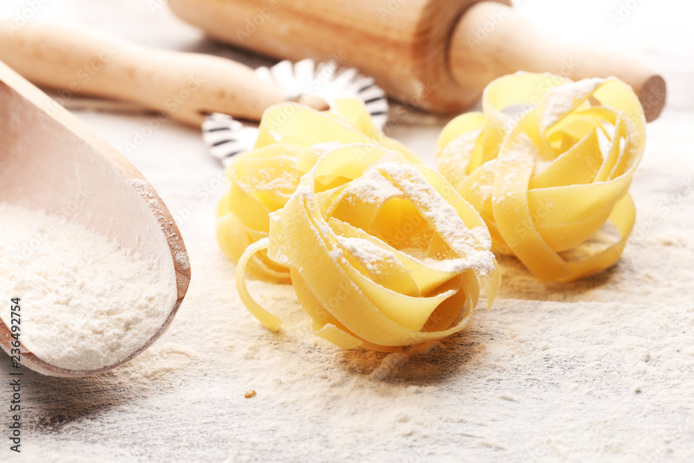 pasta. Fresh homemade pasta with pasta ingredients on the rustic table. pasta. Fresh homemade pasta with pasta ingredients on the rustic table.
