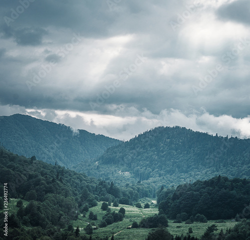 Mountain valley in rainy weather. © Alex Photo