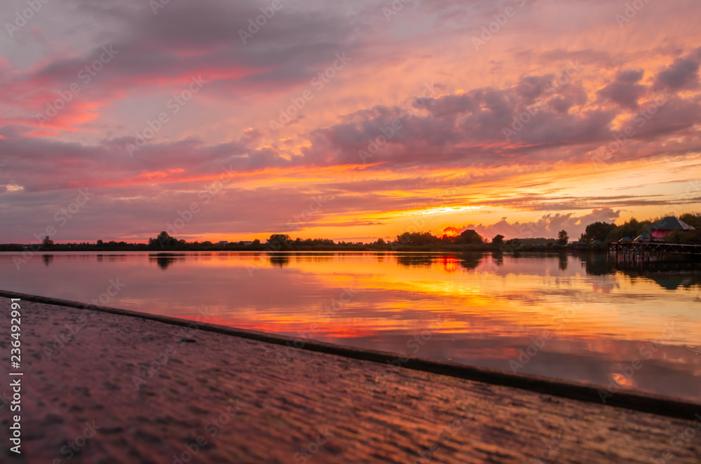 Fototapeta premium Dramatic sunset over the lake.