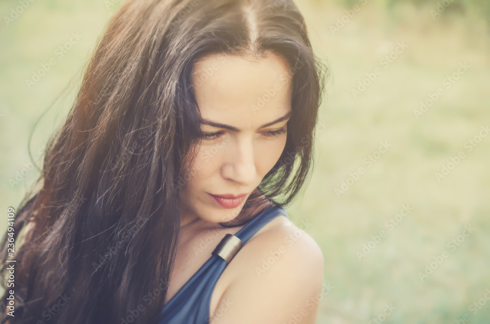 Close-up portrait charming brunette woman on natural background. Sexuality. Women Health. Close-up portrait charming brunette woman on natural background. Sexuality. Women Health.