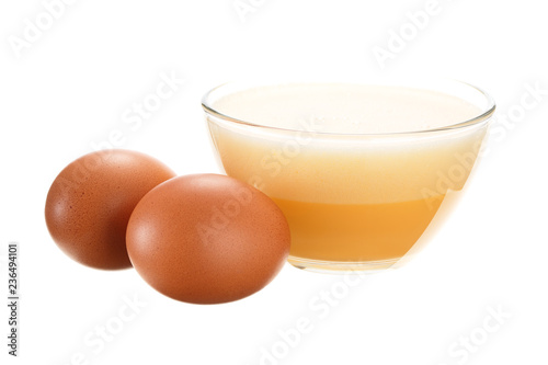 фотографія Beaten egg in a glass bowl. Isolated on white background.