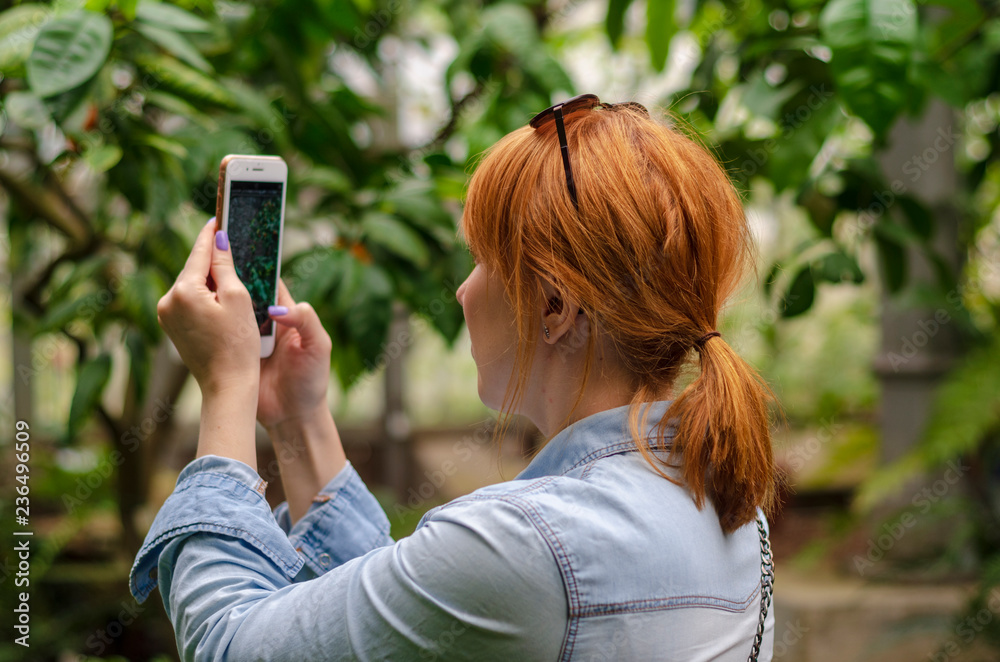 girl with mobile phone in park girl with mobile phone in park